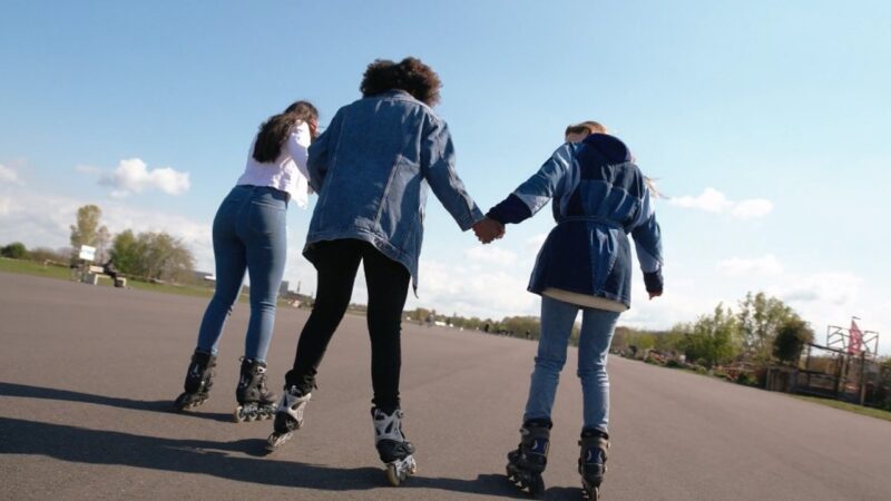 three women over 40 ride roller skating